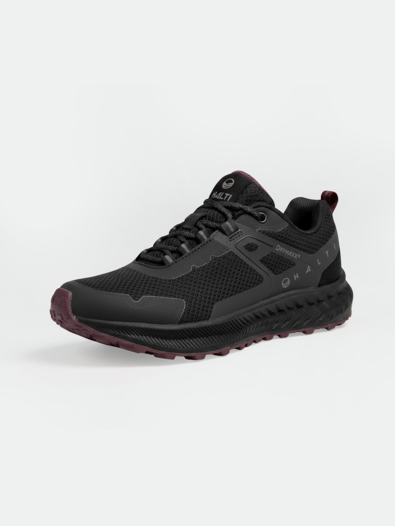 Der Halti Pallas Low 2 DrymaxX Hybrid Sneaker Herren ist schwarz/burgunderrot mit Mesh-Einsätzen und einer Michelin Offroad-Sohle.