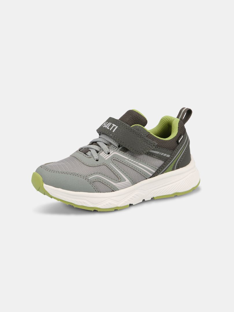 Der Halti Zuma 2 DX Kinder-Sneaker in Grau/Grün verfügt über einen Klettverschluss und eine Phylon-Sohle auf einfarbigem Hintergrund.