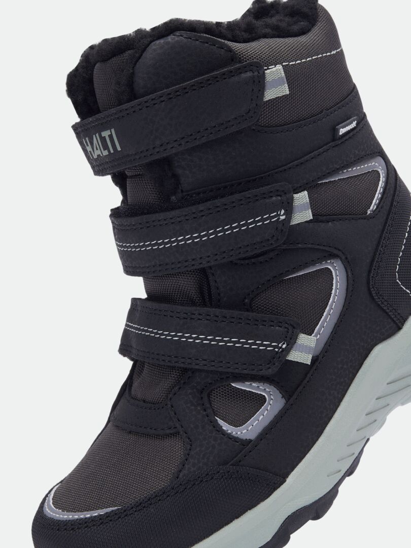 Halti Reiss 3 DX Winterschuhe für Kinder, schwarz mit drei Klettverschlüssen, grauen Akzenten und strukturierter Sohle, Seitenansicht.