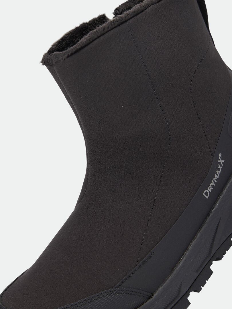 Halti Kajuk Mid DX IC Winterstiefel: wasserdichter, schwarzer Stiefel in Wadenhöhe mit Kunstfellfutter, seitlichem Reißverschluss und Michelin-Sohle.