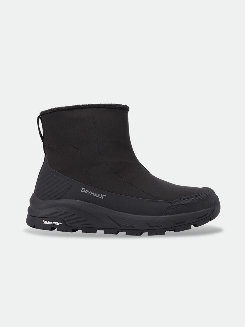 Schwarzer Kajuk Mid DX IC Winter-Stiefelette mit einer robusten Michelin Ice Grip-Sohle und einem DrymaxX-Logo an der Seite.