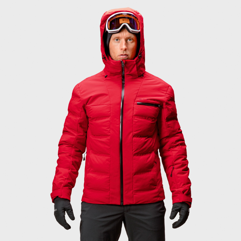 Ein Mann trägt die Halti Nordic Arcty Skijacke Herren mit Microtherm® Arcty-Einsätzen vor einem schlichten Hintergrund.
