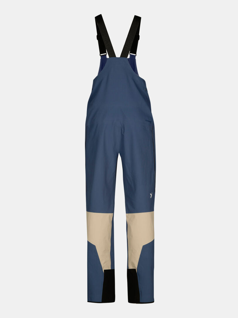 Halti Rizle 3L DX Skihose Unisex in blau und beige mit schwarzen verstellbaren Trägern auf einfarbig weißem Hintergrund.