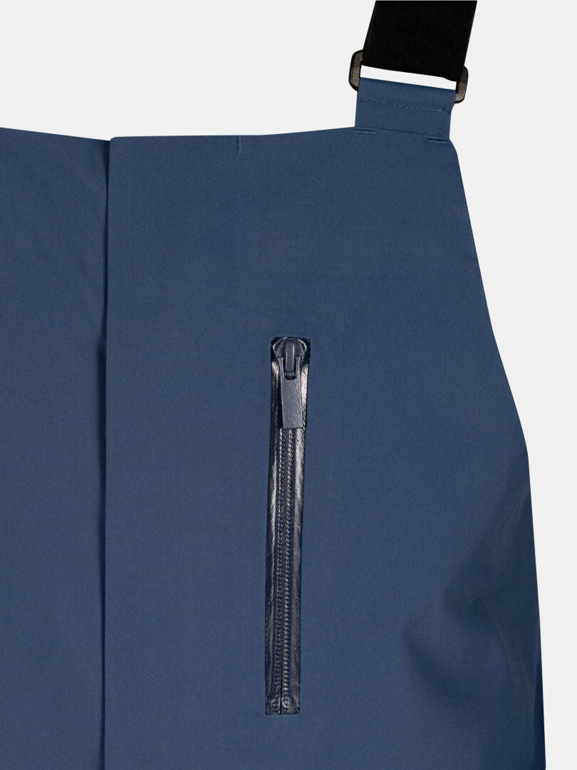 Nahaufnahme der Halti Rizle 3L DX Skihose Unisex, blau, wasserdicht mit Reißverschlusstasche und schwarzem Gurtband.