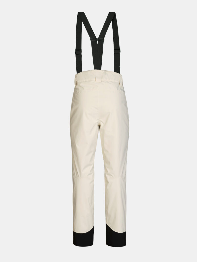 Rückansicht der beigen Halti Carvey II DX Skihose für Damen mit schwarzen Hosenträgern und verstärkten Bündchen.