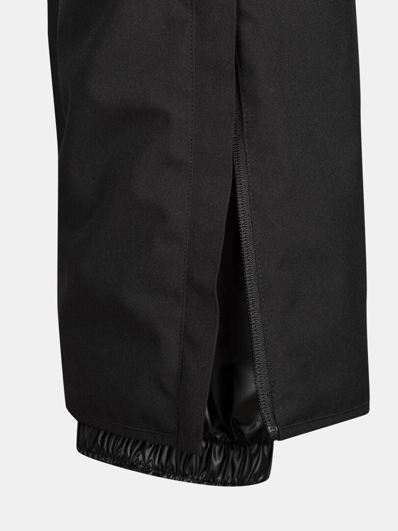 Nahaufnahme der Halti Glades II DX Skihose Damen in schwarz mit Knöchelreißverschluss, mit elastischem Innenbündchen.