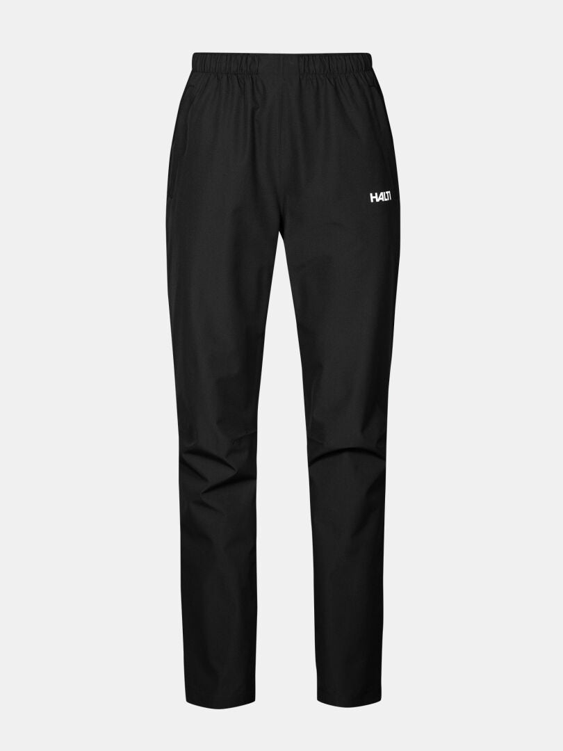 Halti Forter DX Regenhose Damen: schwarz, wasserdicht, elastischer Bund, kleines weißes Logo auf dem linken Oberschenkel.