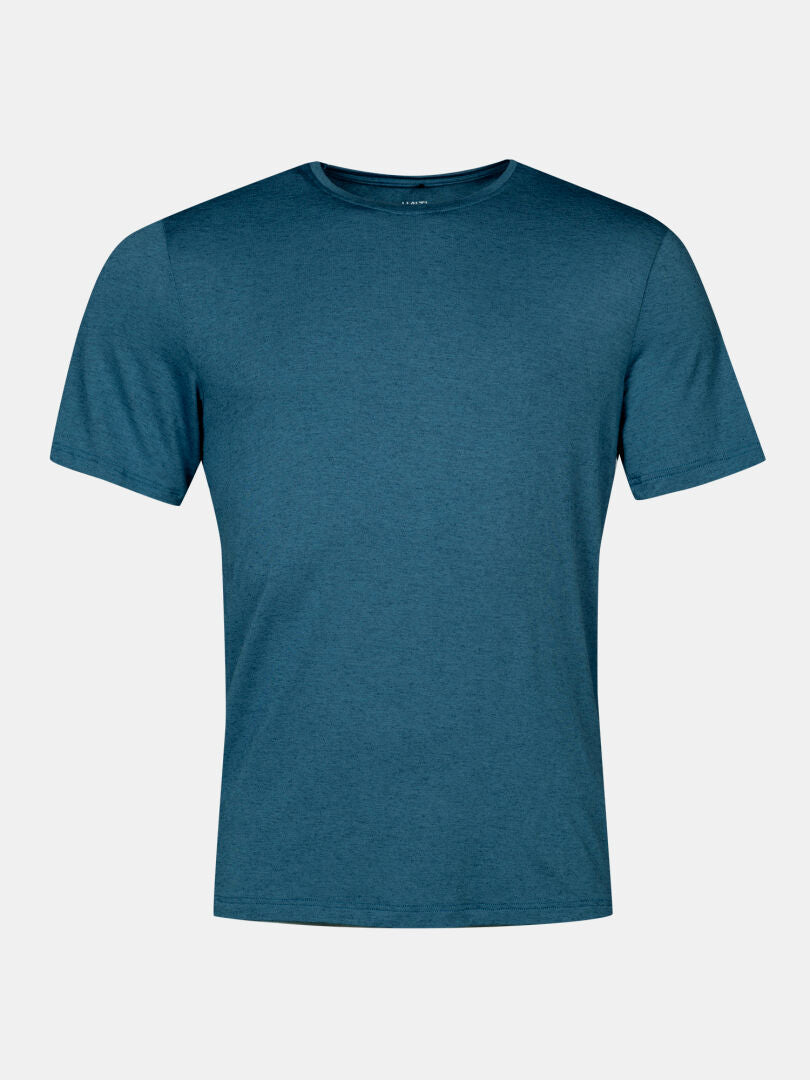 Das Halti Tuntu II Merinoshirt Herren in teal, kurzärmelig, ist auf einem hellgrauen Hintergrund abgebildet.