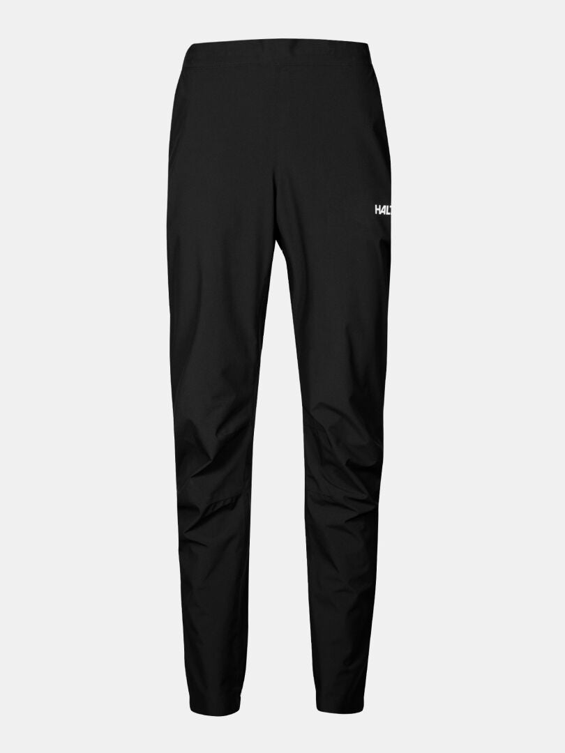 Halti Pisarat 2,5L DX Regenhosen Damen: schmal geschnittene schwarze Regenhose mit elastischem Bund, kleines Logo auf dem linken Oberschenkel.
