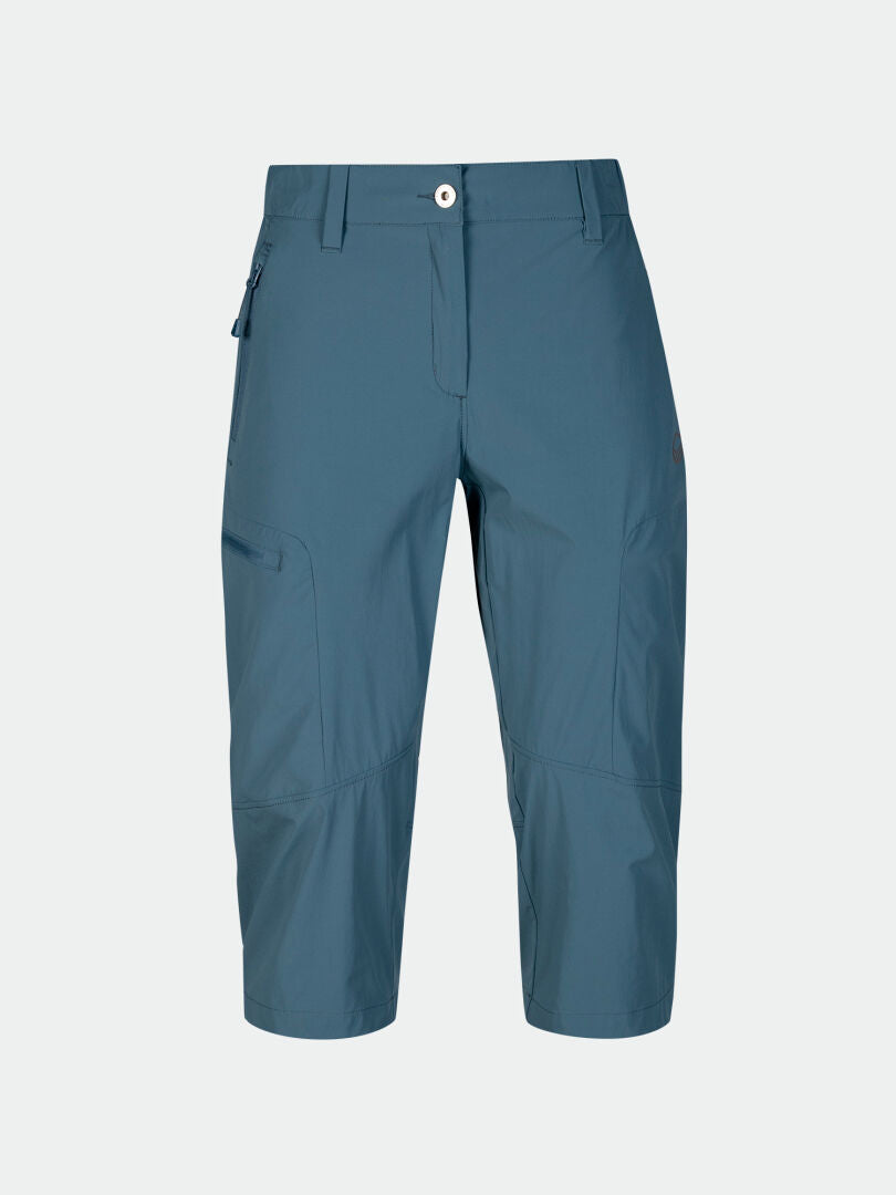 Halti Pallas Cool X-Stretch Caprihose Damen in Blau mit UPF 90+, Reißverschlusstasche, Knopf und Hosenschlitz mit Reißverschluss auf einfarbigem Hintergrund.
