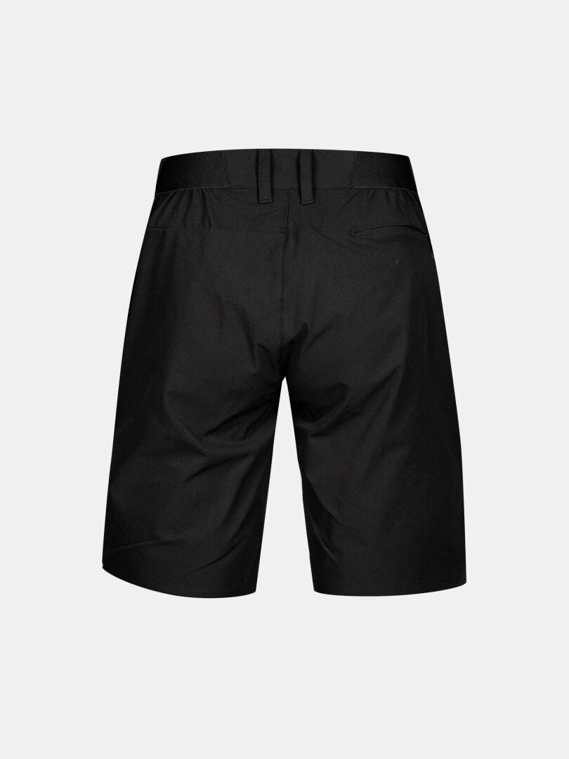 Halti Drive X-stretch Shorts Damen in schwarz, knielang, von hinten gesehen mit Gürtelschlaufen und zwei Gesäßtaschen.