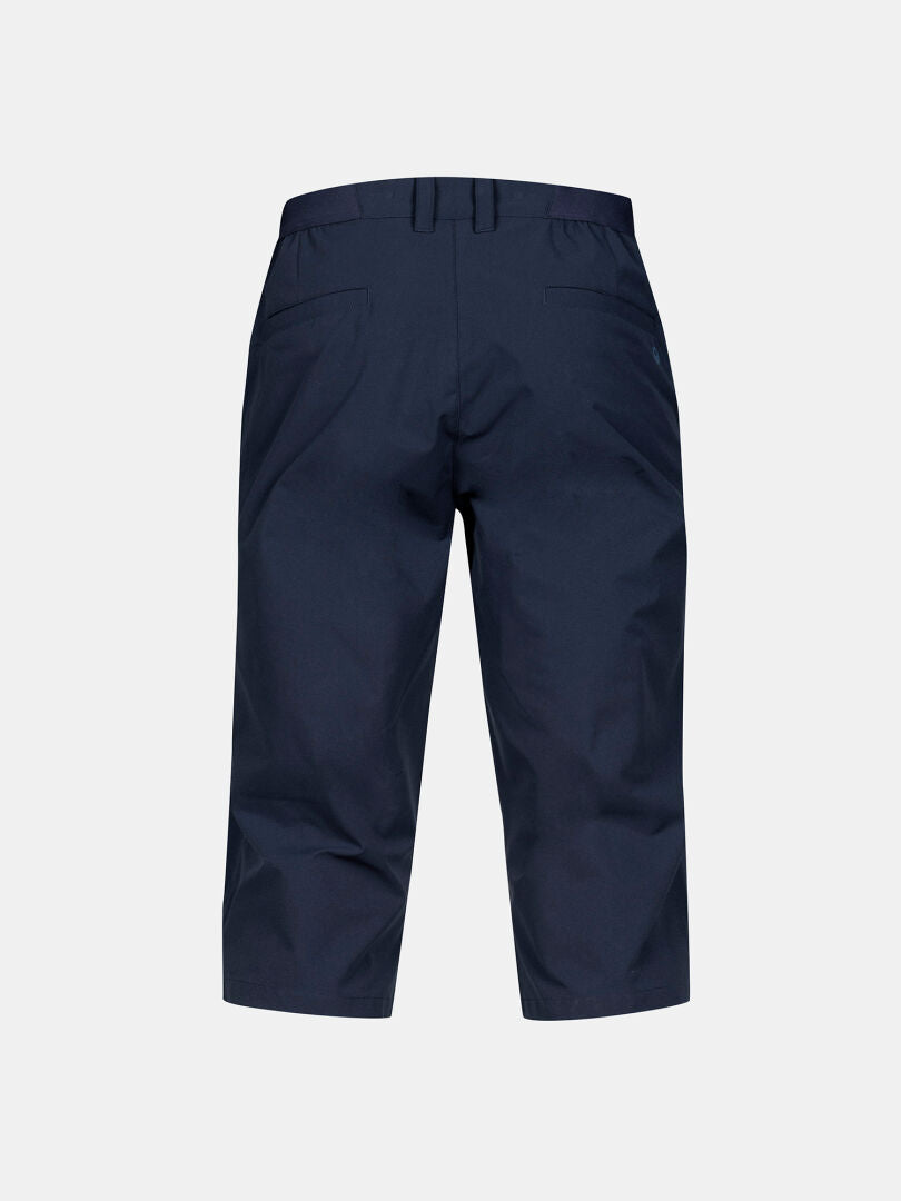 Halti Drive X-stretch Caprihose Herren in marineblau, von hinten gesehen mit Gürtelschlaufen und zwei Gesäßtaschen.