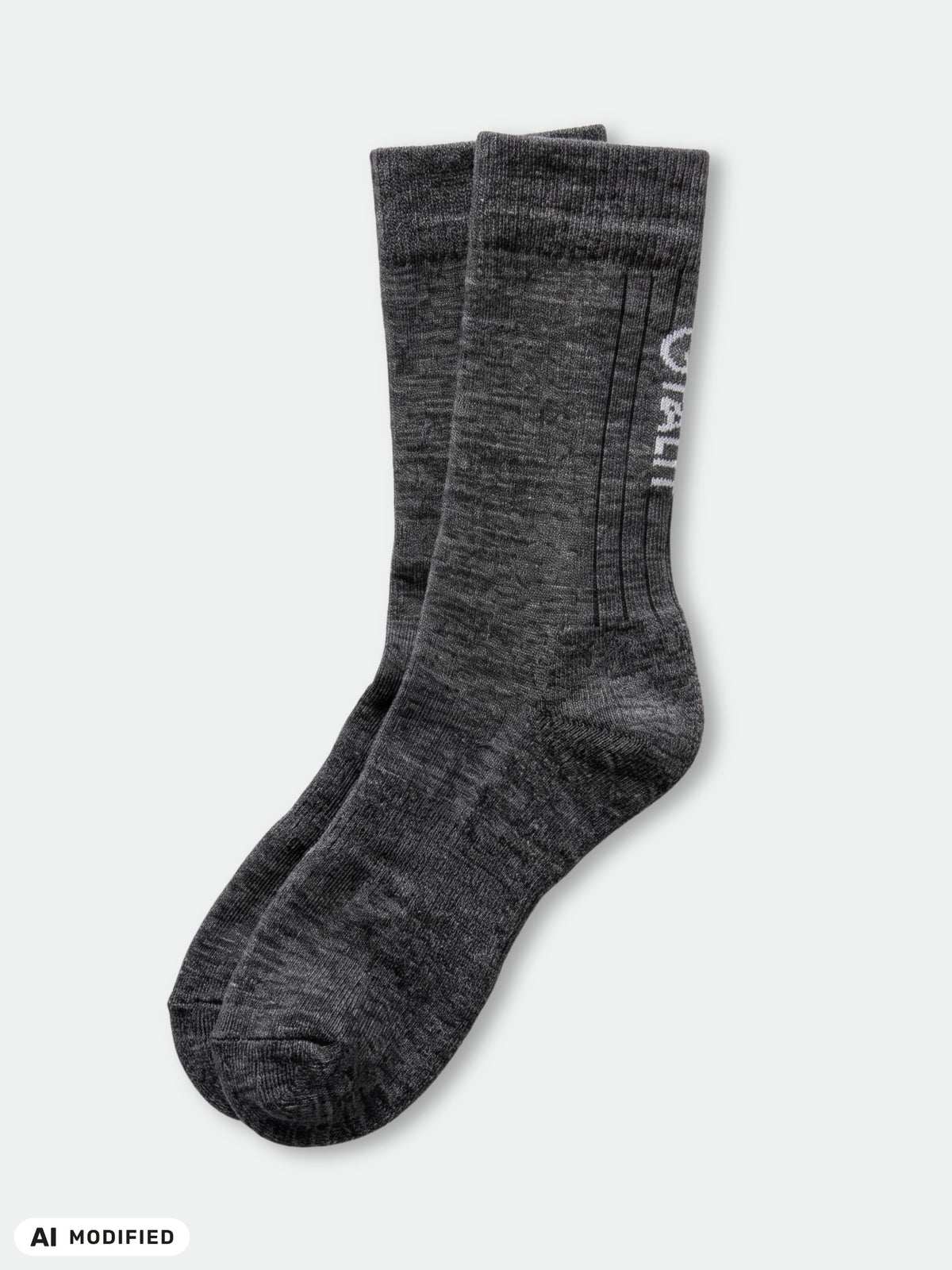 Ein Paar dunkelgraue, melierte Halti-Wandersocken aus Merinowolle.