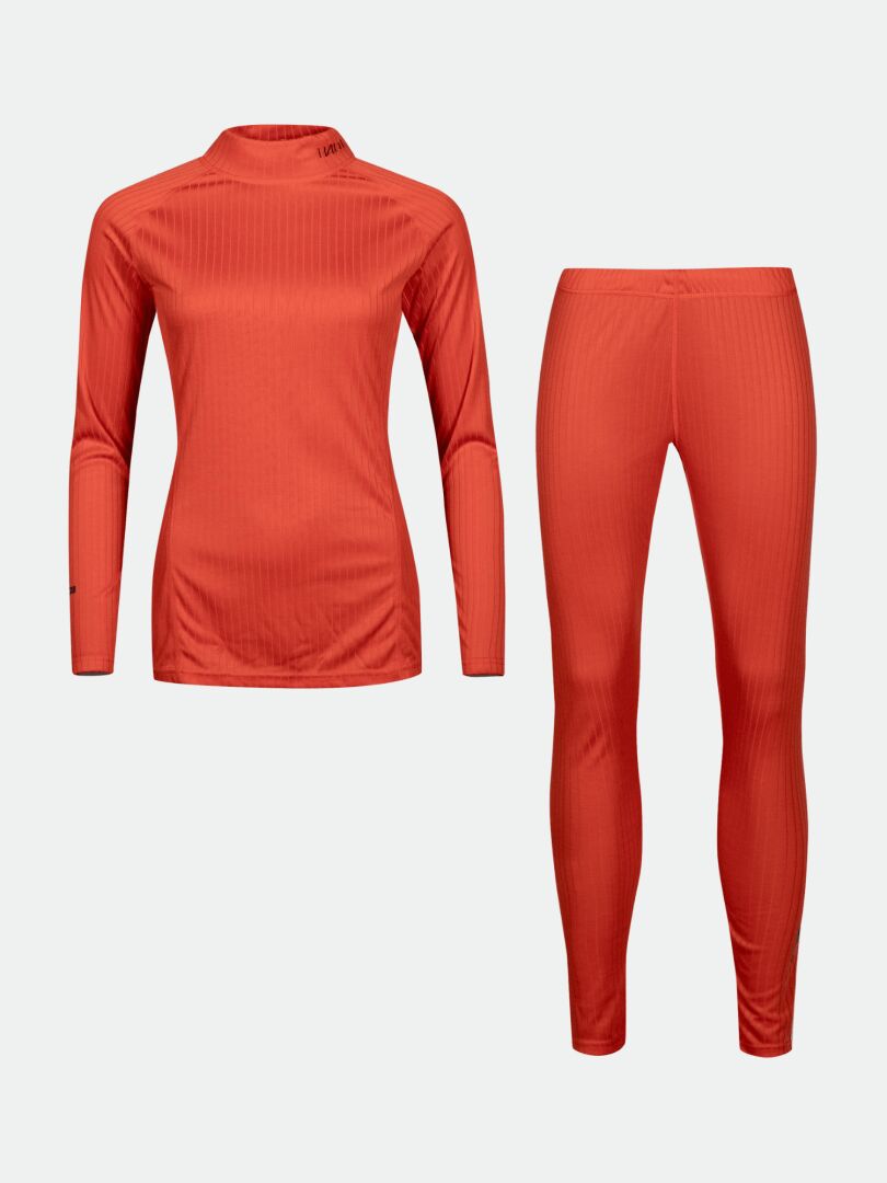 Das Halti Dual Baselayer Set Damen ist ein leuchtend orangefarbenes Set aus Oberteil und Leggings aus recyceltem Polyester.