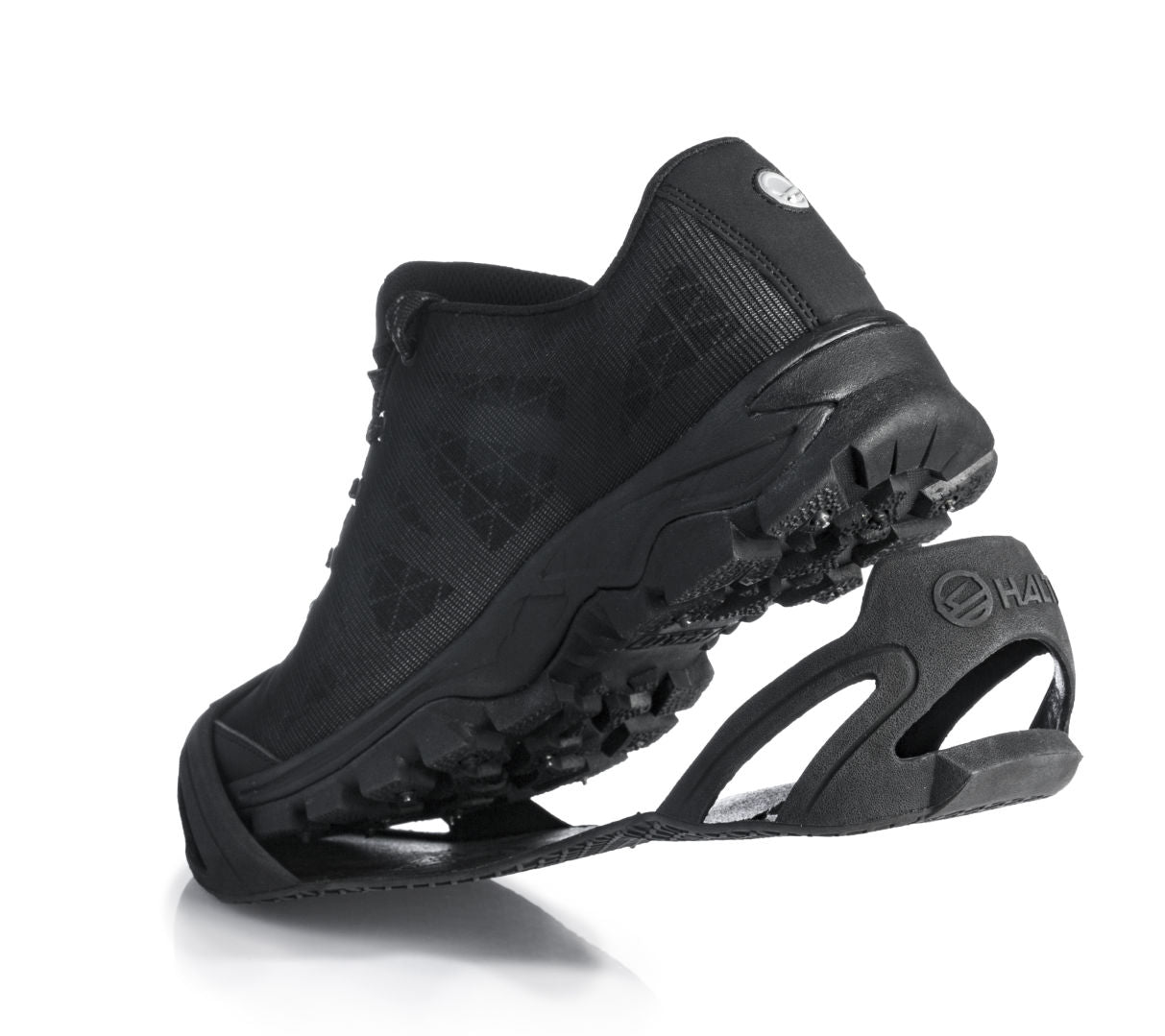 Halti-Schuhüberzug in Schwarz mit abnehmbarer Sohlenhaftung, abgebildet auf weißem Hintergrund.