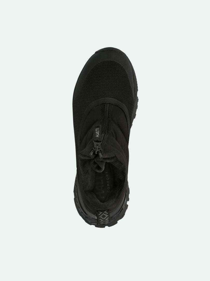 Draufsicht auf Halti Toppari Zip DX Damen-Outdoor-Schuh mit Gummisohle und abgerundeter Spitze vor einfarbigem Hintergrund.