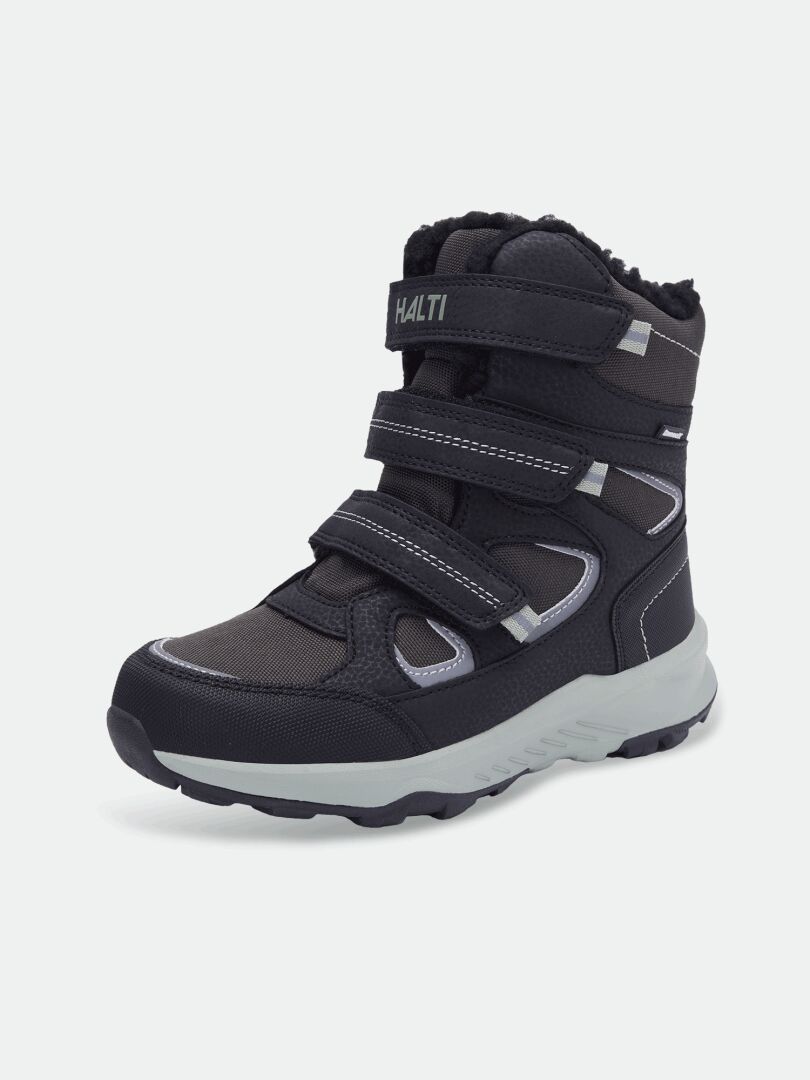Halti Reiss 3 DX Kinderschuhe in Schwarz/Grau mit drei Riemen und GripmaxX Junior-Sohle, schräg abgebildet.