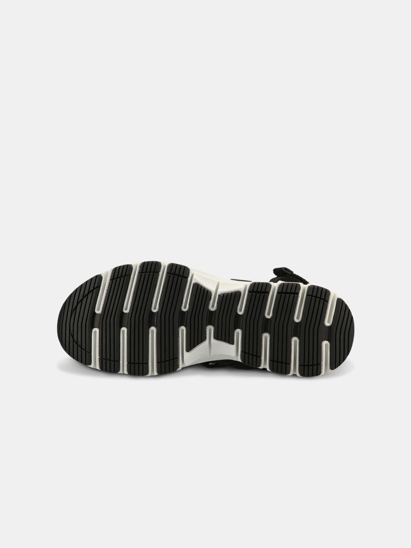 Die Halti Resa 3 Sandale Damen hat eine schwarz-weiße Rillensohle und ein stützendes Memory-Foam Fußbett.