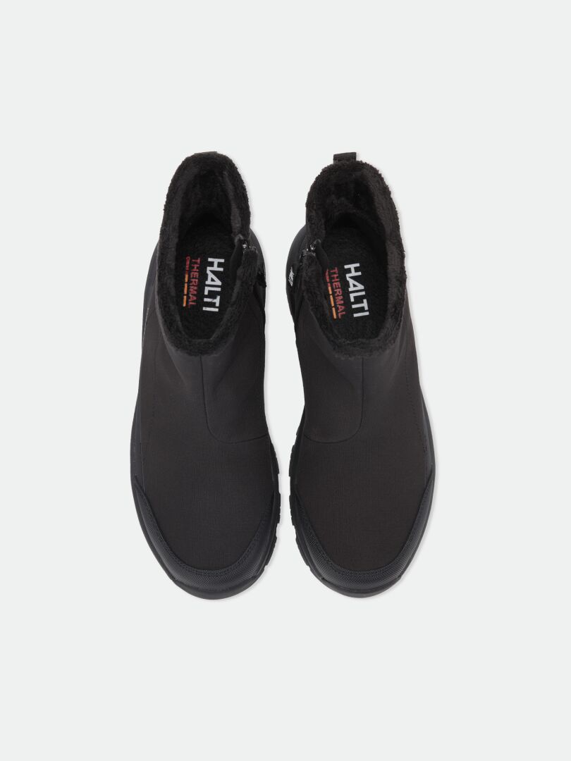Draufsicht auf schwarze Kajuk Mid DX IC Winterschuhe-Stiefel mit Kunstfellfutter, seitlichen Reißverschlüssen und einer Michelin Ice Grip-Sohle.