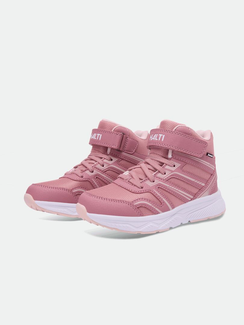 Halti Zuma Mid DX Kinder-Sneaker in Rosa mit weißen Sohlen und Klettverschlüssen, abgebildet auf einem schlichten weißen Hintergrund.