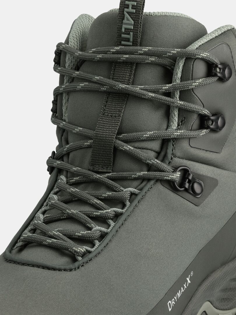 Nahaufnahme der Halti Fara 4 DX Mid Outdoor-Schuhe für Herren in Grün, mit Schnürsenkeln, Metallösen und DRYMAXX-Logo.