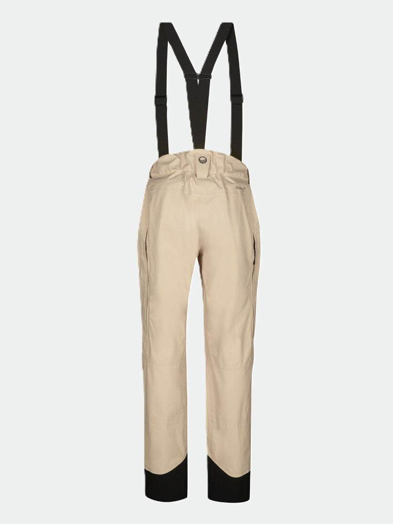 Beige Settler 3L DrymaxX Skihose Damen von Halti mit schwarzen Hosenträgern vor weißem Hintergrund.