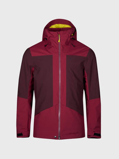Die Halti Planker DrymaxX Skijacke Herren in Maroon mit gelbem Futter und Frontzipper auf grauem Hintergrund.