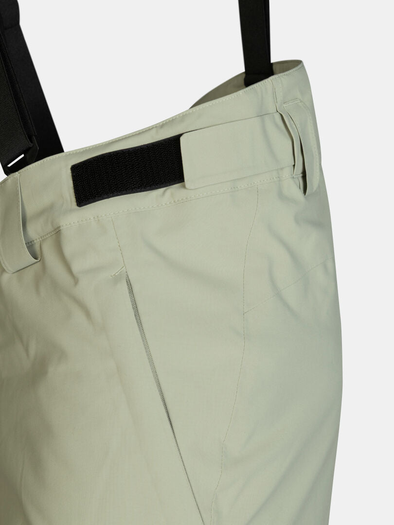 Hellgrüne Halti Carvey II DX Skihose für Herren mit verstellbarem Bund, Klettverschlüssen und schwarzen Hosenträgern.