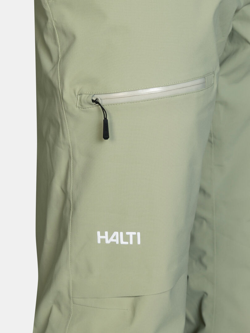 Halti Carvey II DX Skihose für Herren in Salbeigrün mit einer Reißverschlusstasche und einem Logo am Saum.