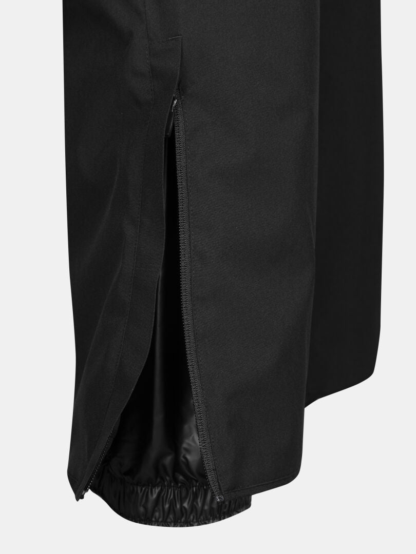 Nahaufnahme der Halti Glades II DX Skihose Herren in schwarz, mit geöffnetem Seitenreißverschluss und elastischem Innenbündchen.