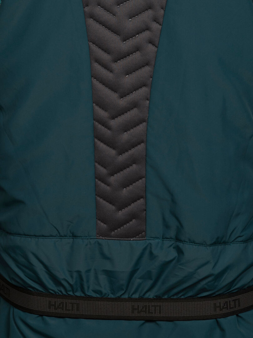 Dunkelblaugrüne Halti Varion 2in1 DX Skijacke für Damen mit vertikal gestepptem Mittelteil und elastischem Saum mit Markenlogo.