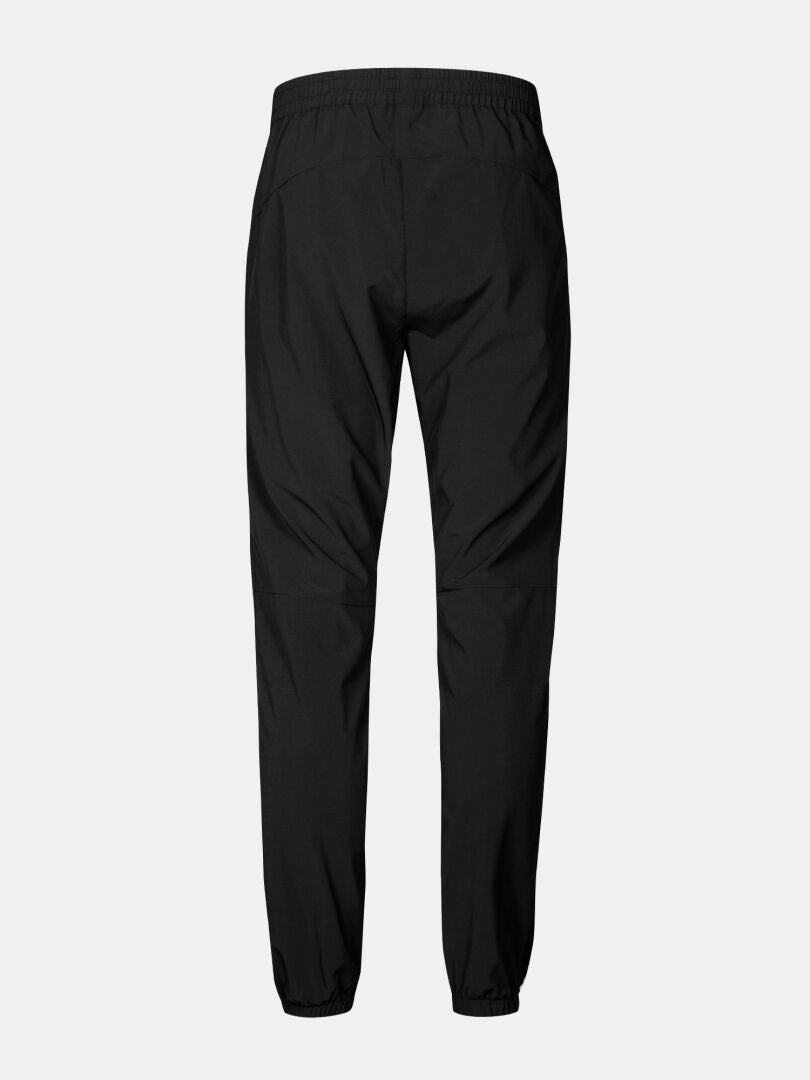 Halti Grets Joggers Herren in schwarz mit elastischem Bund, Bündchen und Quick Dry Stretch Material. Abgebildete Rückenansicht.