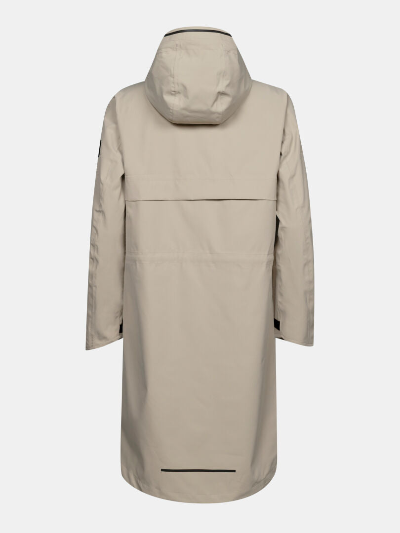 Halti Tokoi II DX Damenparka: Beige, wasserdicht, schlichtes Design mit schwarzen Akzenten am Saum und am Rücken.