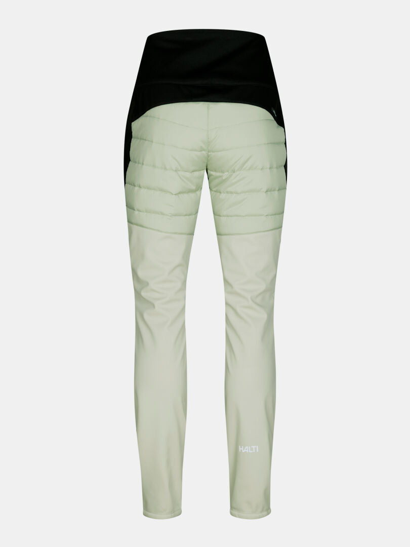 Rückansicht der hellgrünen Hanki 2 Hybrid-Langlaufhose für Damen mit gestepptem Oberteil und glatten Hosenbeinen – ideal für Winteraktivitäten.