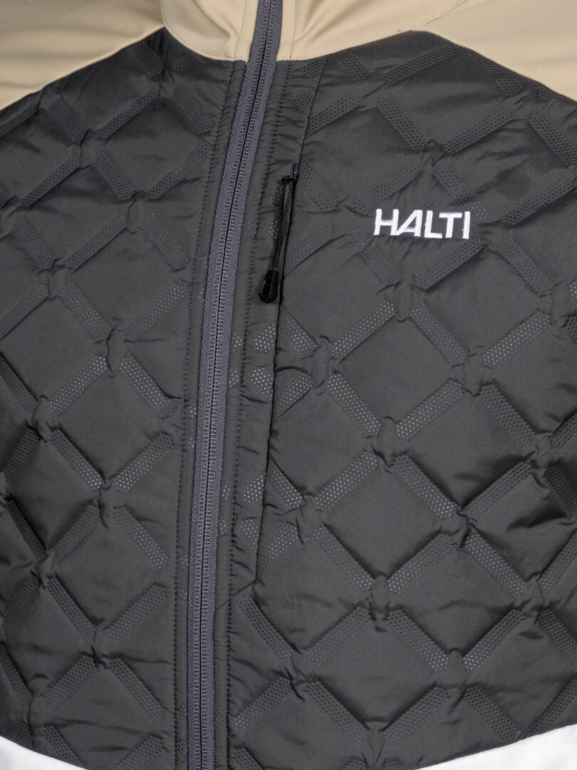 Nahaufnahme der Halti Framover Hybrid Langlaufjacke Herren mit schwarz-beigen Einsätzen und Reißverschluss - perfekt für das Wintertraining.