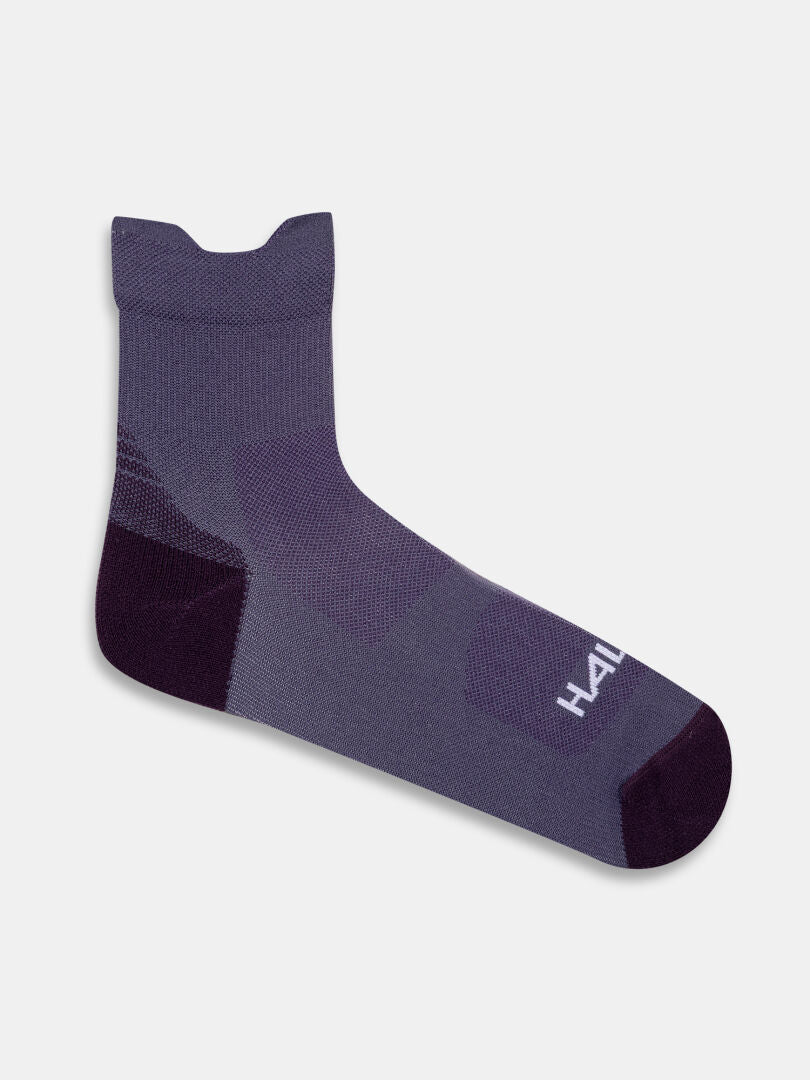 Eine einzelne Halti Active Sport Socke in lila und schwarz, von der Seite auf weißem Hintergrund.