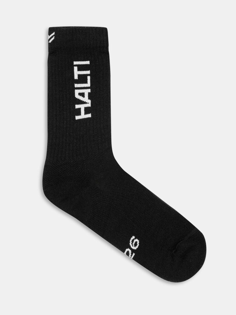 Eine einzelne schwarze 1976 Socke von Halti, ideal zum Wandern, mit HALTI in weiß auf einem schlichten weißen Hintergrund.