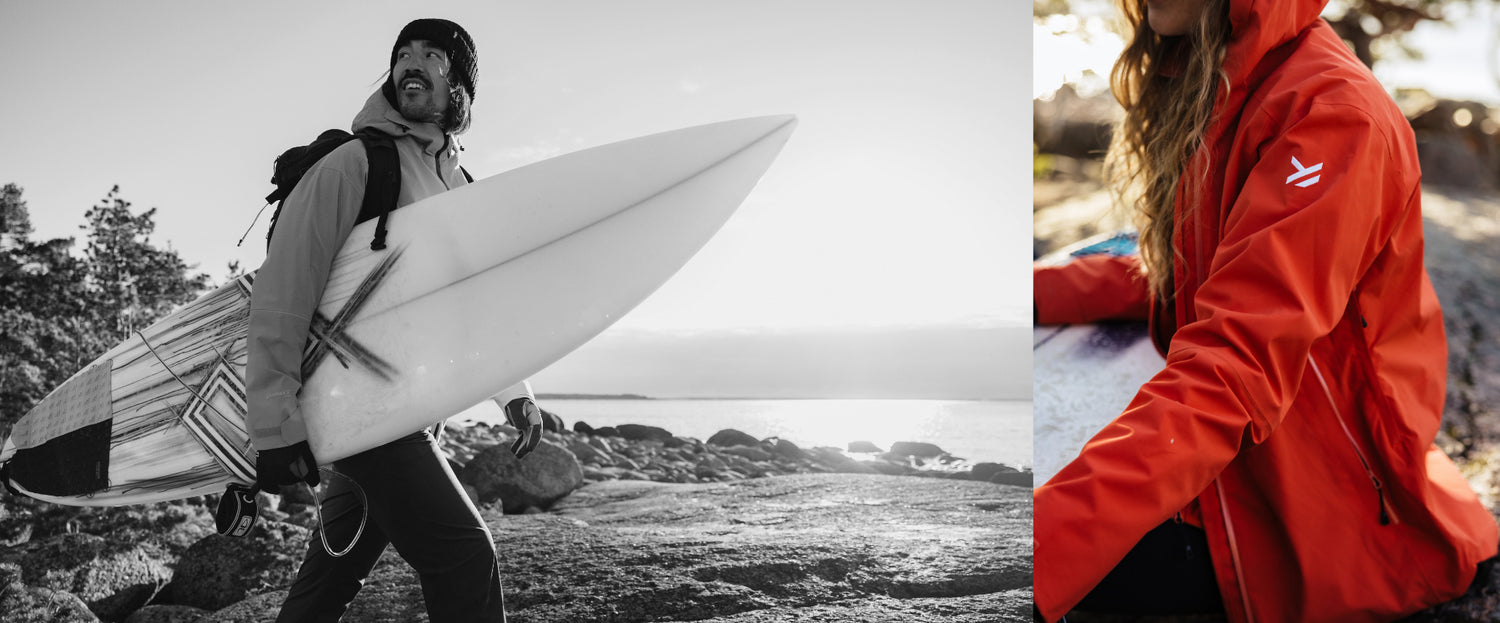 Zwei Personen beim Outdoor-Abenteuer in Halti Shell-Jacken, eine davon in leuchtendem Rot